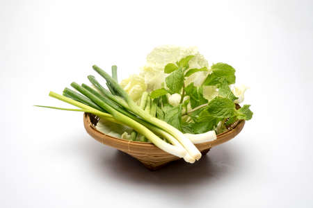 Fresh vegetables in woven bamboo basketsの写真素材