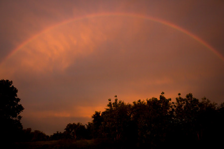sky after raining with a rainbow in the skyの写真素材