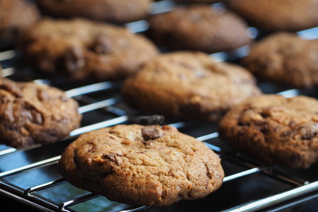 The chocolate chip newly baked cookies place on grill