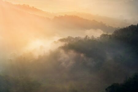 Mountain view at morning with mist on mountain peak.の写真素材