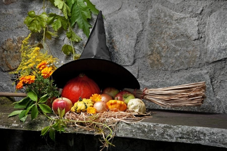 halloween still life with witch hat and broom
