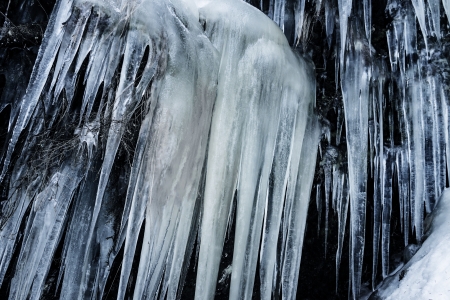 big icicles on a rock - winter timeの写真素材