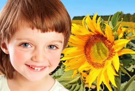 little girl and sunflowerの写真素材
