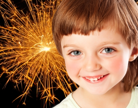 little girl and fireworks の写真素材