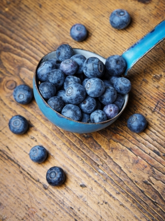 a ladle with blueberriesの写真素材
