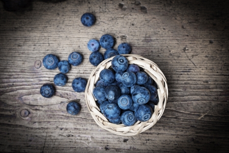 fresh blueberries on an old table - still lifeの写真素材