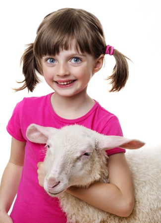 happy little girl with a lambの写真素材