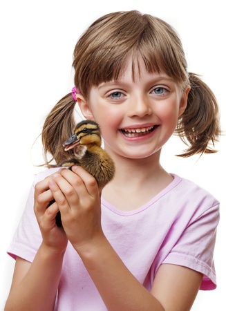 little girl with cute ducklingの写真素材