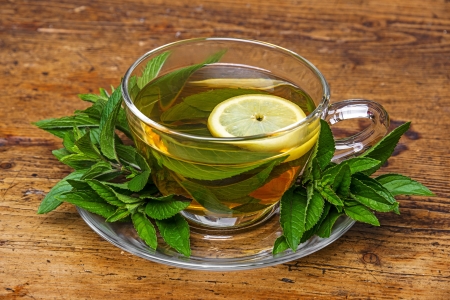 mint tea on old wooden tableの写真素材