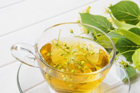 linden tea on a white wooden tableの写真素材