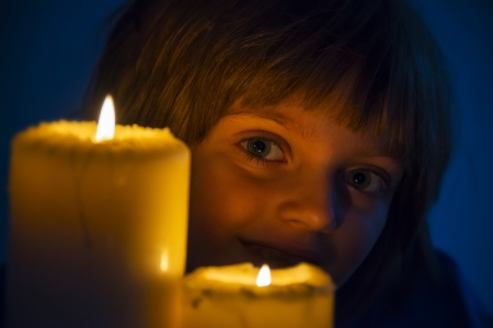 happy girl with candlesの写真素材