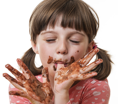 little girl eating a chocolate little girl eating a chocolate