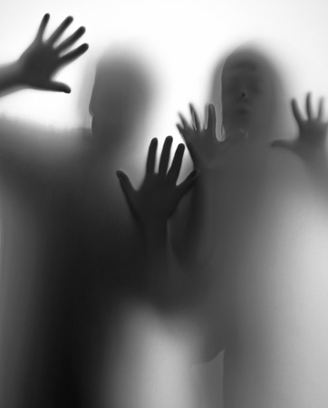 shadow of people behind transparent paperの写真素材
