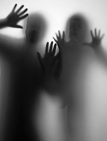 shadow of people behind transparent paperの写真素材
