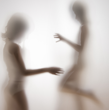 shadow of a girl behind transparent paperの写真素材