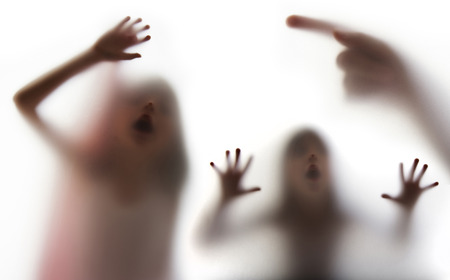 a girl  silhouette behind a  transparent  paperの写真素材