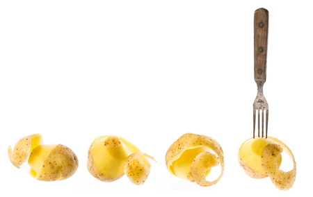 a fresh raw potatoes on a white backgroundの写真素材