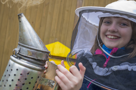 little girl - young beekeeper - close upの写真素材