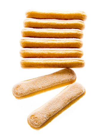 sponge biscuit - ladyfinger savoiardi isolated over a white backgroundの写真素材