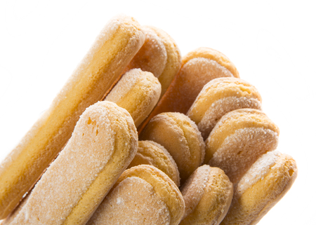 sponge biscuit - ladyfinger savoiardi isolated over a white backgroundの写真素材