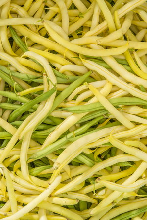 Fresh raw beans on a white background