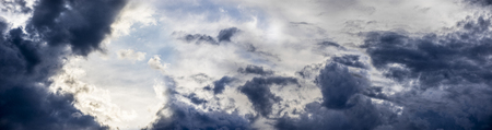 the dark clouds on blue sky - texture close upの写真素材