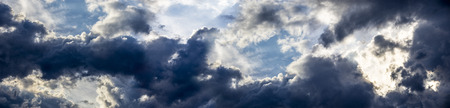 the panoramic view on blue sky with dramatic clouds