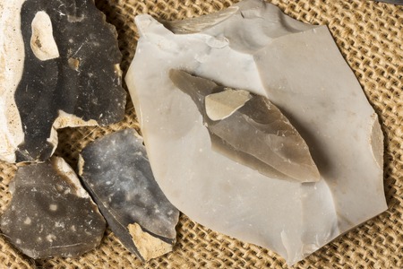 an arrowhead made from flintstone close up - experimental archeologyの写真素材