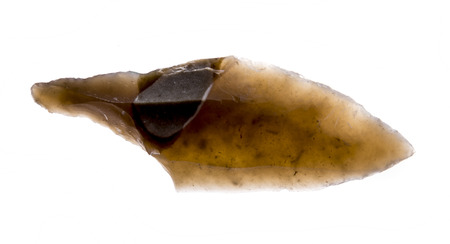 an arrowhead made from flintstone close up - experimental archeologyの写真素材