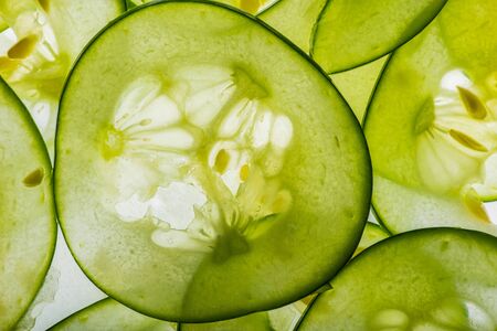 sliced cucumbers close upの写真素材