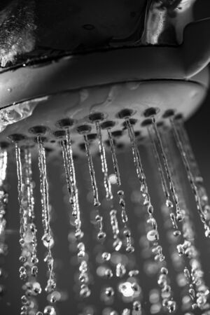 Water flowing from shower - close up - macro detail - high speed photoの写真素材