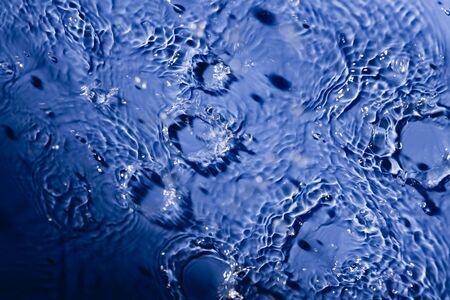 Falling water drops - rain in macro detail
