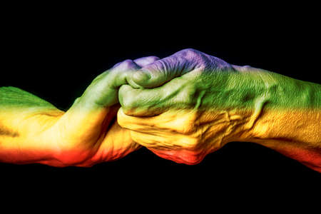 LGBT support, hands and rainbow colors spectrum flag - pride flag LGBT rights concept