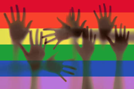 LGBT support, hands and rainbow colors spectrum flagの写真素材