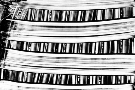 black smudge and blur marks on white paper - abstract black and white texture background