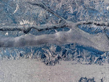 Ice crystals in the detail on a window glass in winter time