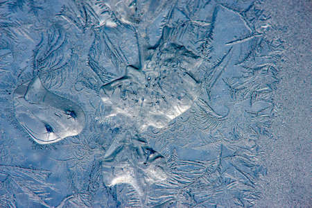 Ice crystals in the detail on a window glass in winter time