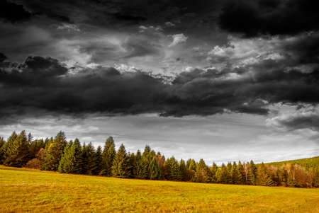 autumnal landscape and black and white sky