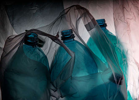 plastic bottles and plastic bags - ecology background - recycling