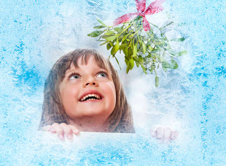 little girl with white board with empty space - bokeh backgroundの写真素材