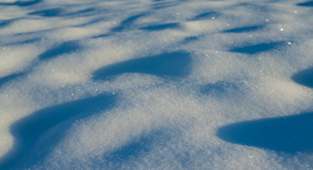winter snow background - snow covered surface and artistic bokehの写真素材