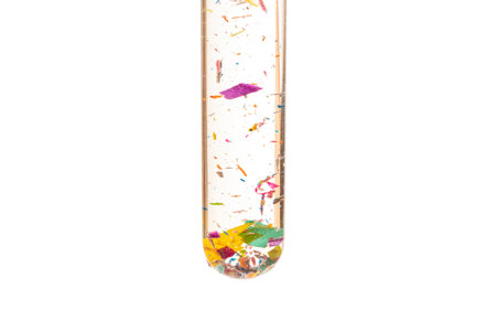 Microplastics in a glass of water water - polluted waterの写真素材