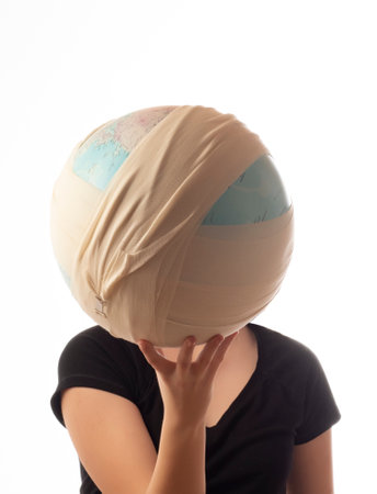 Teenager caucasian girl holding ill planet - Earth globe in bandage . Climate change, enviromental...