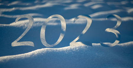 new year 2023 - winter snow background - snow covered surface and artistic bokehの写真素材