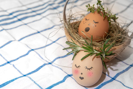Easter egg with cute face in green plant wreath. Sleepy easter egg - Home crafts happy haster...