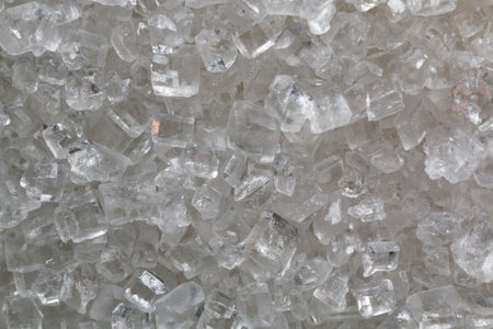 macro photography of white crystal sugar - sugar crystals magnified under a microscopeの写真素材