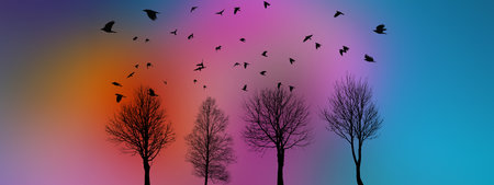 black silhouettes of flying birds and treesの写真素材