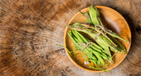 Fresh green beans on a wooden backgroundの写真素材