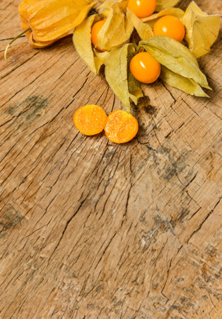 Physalis fruit ( Physalis peruviana) ion and wooden backgroundの写真素材