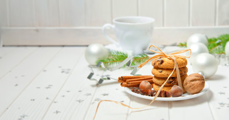 christmas still life with biscuits and a cut of teaの写真素材